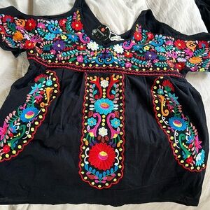 New with tags beautiful embroidered top.
